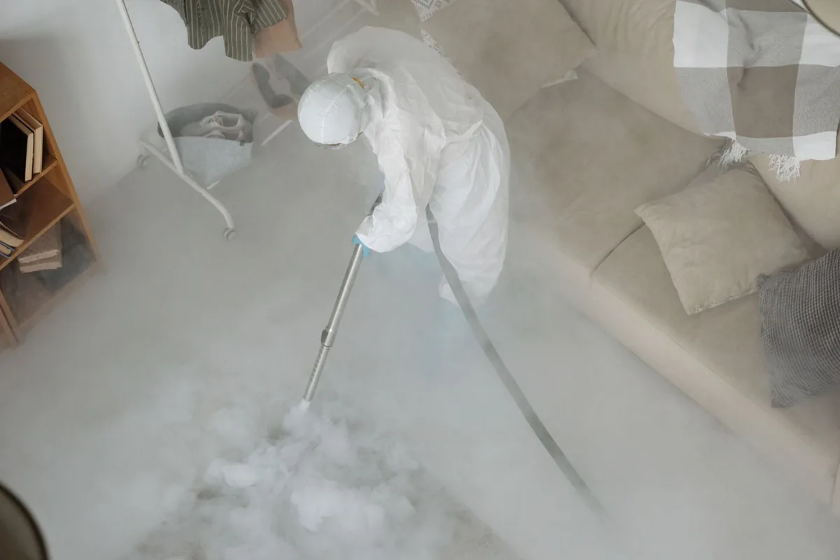 Biohazard cleanup technician in protective equipment, Holtville, AL